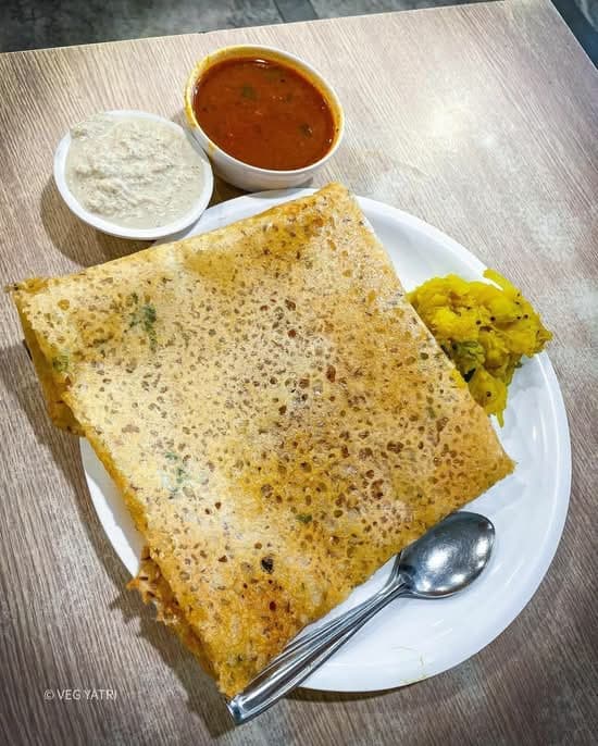 Crisp rava masala dosa folded over a potato masala filling